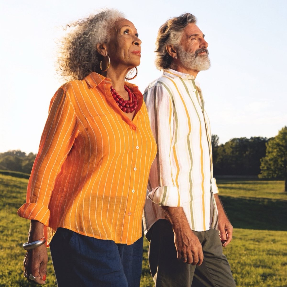 Happy senior couple walking together outdoors